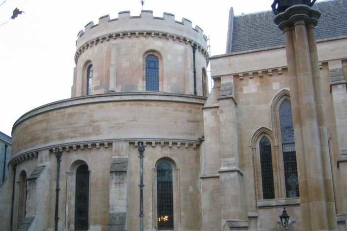 a large stone statue in front of Temple Church