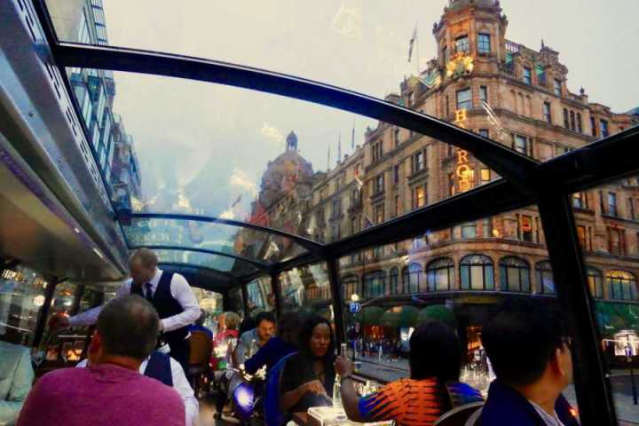 a group of people sitting at a bus stop