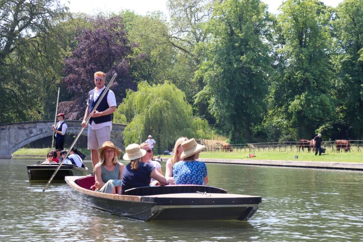 a group of people riding on the back of a boat